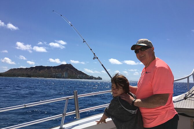 3-Hour Fishing Trip in Waikiki - Stop 1: Waikiki Beach, lines in the water with city views