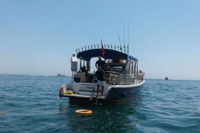 Agadir Boat trip and Fishing - Cruising the coast with the Atlas in view