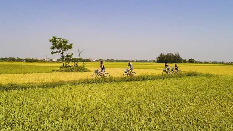 Hoi An : Eco Bicycle Tour with Fishing and Lunch/Dinner - Organic garden stop and farmer uniform: the practical side of “eco”