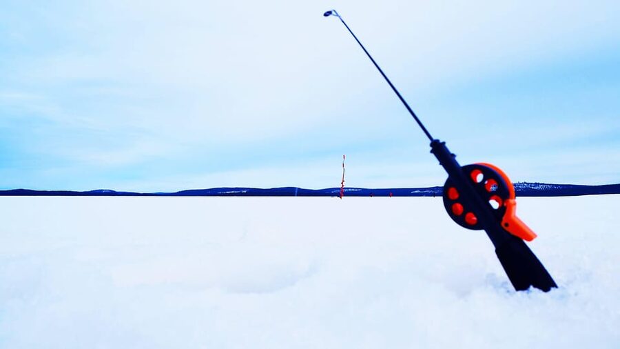 Ice fishing program in Lapland - Making the hole and learning the basics of ice fishing