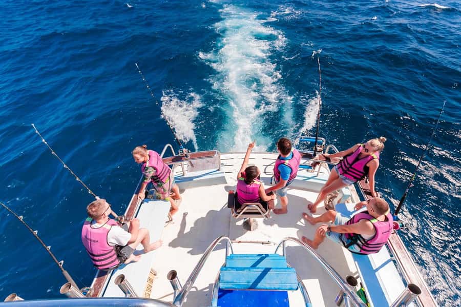 Phuket: Game Fishing and Trolling Boat Trip with Lunch - The 8-Hour Flow: Pickup, Trolling, Fishing, Racha Island, Back Again