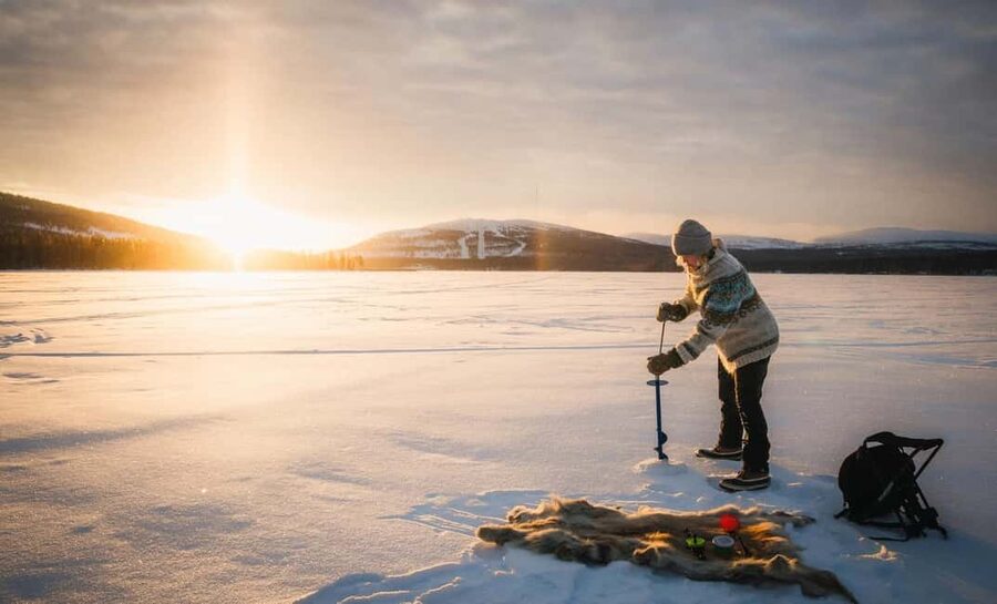Pyhä: Ice Fishing Experience at Frozen Lake - Drilling the hole and setting up your fishing spot the Finnish way