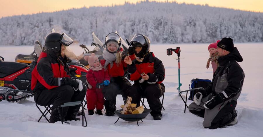 Rovaniemi: Ice Fishing and Snowmobile Tour with Snacks - Ice fishing on a frozen lake: calm work, real skill