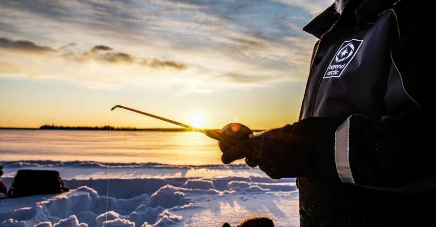 Rovaniemi: Ice Fishing on a Frozen Lake with BBQ and Photos - Campsite Break: Campfire Warmth, Hot Drinks, and BBQ Time
