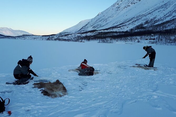 Sjursnes Arctic Ice Fishing Adventure from Tromso - Arriving at the frozen lake: camp setup and that first hole-drill moment