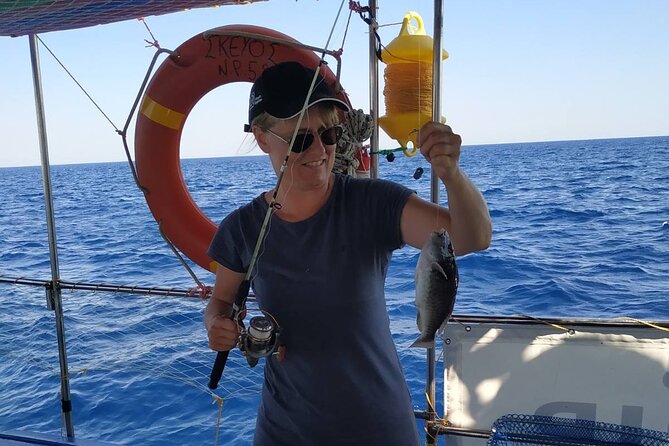 Skevos Fishing Trip Rhodes - Lunch on Board: BBQ Fish, Greek Salad, and Rhodian Oregano