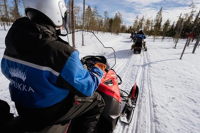 Snowmobiling and ice fishing in Apukka Resort, Rovaniemi - Snowmobile ride through Arctic forests: what “safe” looks like in practice